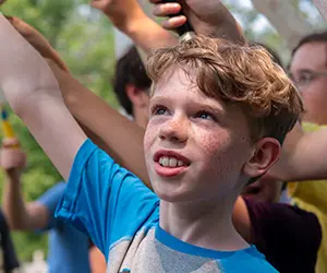 A photo of a child participating in a program.